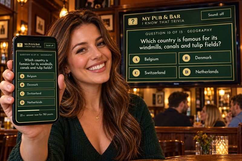 A customer holding a phone with a trivia question, in front of a pub TV showing the same question